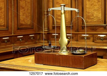 Medicine on a set of antique scales in chemist's lab View Large Photo Image Stock Photo - Medicine on a set of antique scales in chemist's lab. Fotosearch