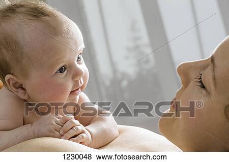 Stock Photo - Mother and daughter face to face. Fotosearch