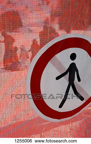 No pedestrian sign hanging on a mesh barrier View Large Photo Image Stock Photograph - No pedestrian sign hanging on a mesh barrier. Fotosearch