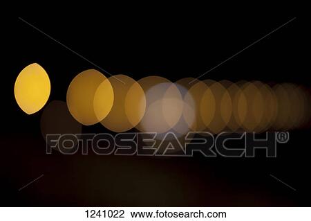 Orange circular light pattern against a black background View Large Photo Image Stock Image - Orange circular light pattern against a black background. Fotosearch