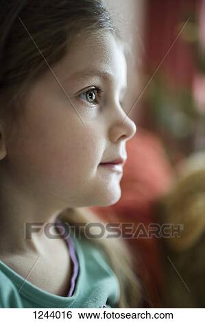 Stock Photograph - Pensive girl looking away. Fotosearch