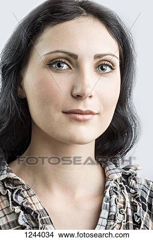 Portrait of beautiful woman looking at camera View Large Photo Image Picture - Portrait of beautiful woman looking at camera. Fotosearch