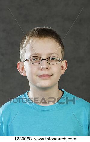 Portrait of boy wearing glasses View Large Photo Image Stock Photo - Portrait of boy wearing glasses. Fotosearch
