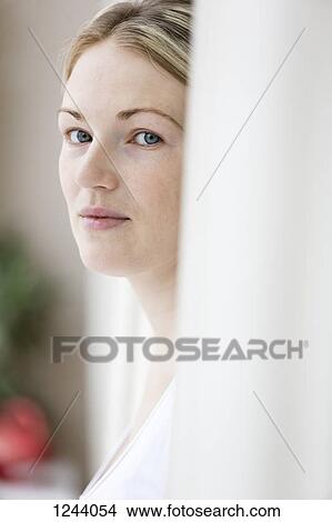 Portrait of woman looking to the side at camera View Large Photo Image Picture - Portrait of woman looking to the side at camera. Fotosearch