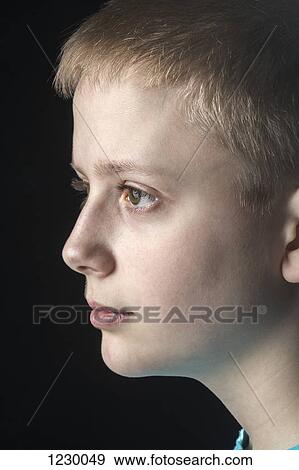 Profile of daydreaming boy View Large Photo Image Stock Photo - Profile of daydreaming boy. Fotosearch