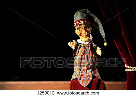 Punch from the classic puppet show Punch and Judy sitting on stage View Large Photo Image Stock Image - Punch from the classic puppet show Punch and Judy sitting on stage. Fotosearch