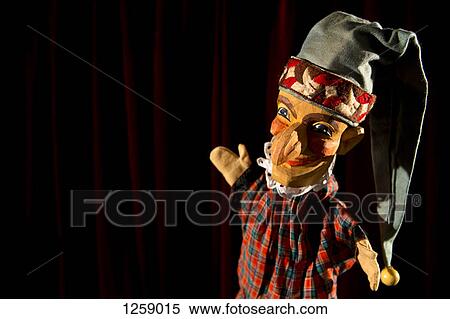 Stock Photography - Punch from the puppet show Punch and Judy on stage smiling proudly. Fotosearch