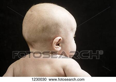 Stock Image - Rear view of baby girl. Fotosearch