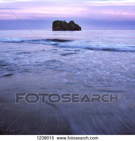 Seascape and island under a dusk sky View Large Photo Image Stock Photography - Seascape and island under a dusk sky. Fotosearch