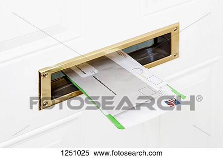 Several pieces of mail stuck in a front door mail slot, close-up View Large Photo Image Stock Photography - Several pieces of mail stuck in a front door mail slot, close-up. Fotosearch