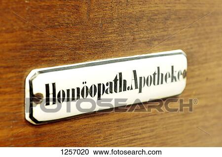Stock Image - Sign reading 'Homeopathic Pharmacy' in German. Fotosearch