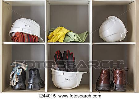 Storage of protective headwear, footwear and gloves View Large Photo Image Stock Photography - Storage of protective headwear, footwear and gloves. Fotosearch