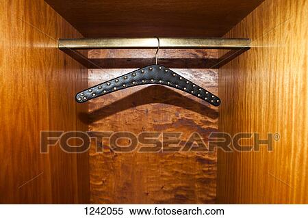 Studded leather belt hanger in wardrobe View Large Photo Image Stock Photography - Studded leather belt hanger in wardrobe. Fotosearch