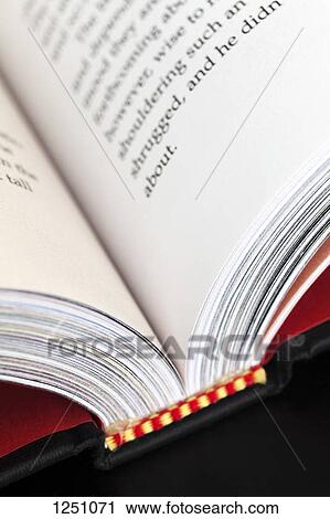 Text in an open hardcover book, close-up View Large Photo Image Stock Image - Text in an open hardcover book, close-up. Fotosearch