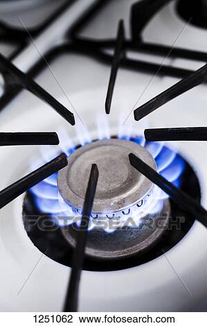 The blue flame of a lit gas stove burner, close-up View Large Photo Image Stock Image - The blue flame of a lit gas stove burner, close-up. Fotosearch
