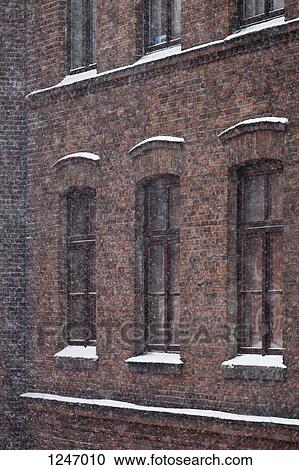 The exterior of a brick building during a blizzard View Large Photo Image Stock Image - The exterior of a brick building during a blizzard. Fotosearch