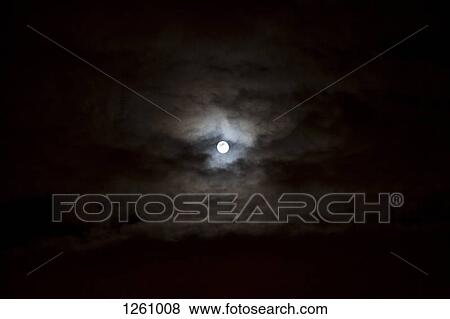 The full moon seen in the sky surrounded by clouds View Large Photo Image Stock Photo - The full moon seen in the sky surrounded by clouds. Fotosearch