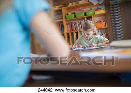 Two girls doing homework View Large Photo Image Stock Image - Two girls doing homework. Fotosearch