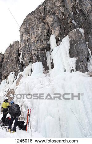 Two skiers prepare for ice climb at Lagazuoi, South Tyrol, Italy View Large Photo Image Stock Photograph - Two skiers prepare for ice climb at Lagazuoi, South Tyrol, Italy. Fotosearch