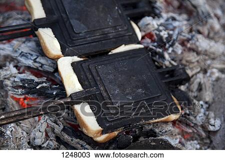 Two toasted sandwich makers on the campfire View Large Photo Image Stock Image - Two toasted sandwich makers on the campfire. Fotosearch