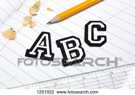 Varsity font stickers spelling out A, B, C atop a lined paper notebook with ruler and pencil View Large Photo Image Stock Image - Varsity font stickers spelling out A, B, C atop a lined paper notebook with ruler and pencil. Fotosearch