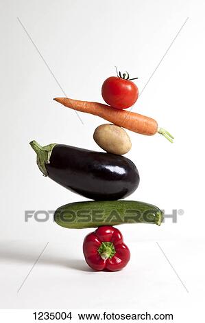 Vegetables arranged in a stack View Large Photo Image Picture - Vegetables arranged in a stack. Fotosearch