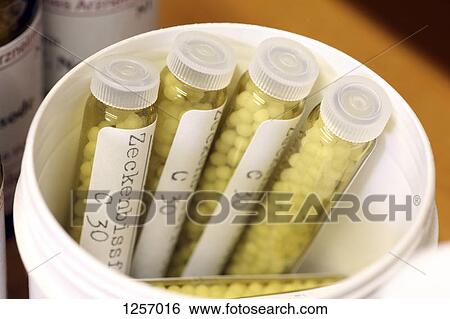 Vial of homeopathic pills for tick-bite View Large Photo Image Stock Photograph - Vial of homeopathic pills for tick-bite. Fotosearch