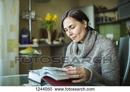 Stock Image - Woman reading book. Fotosearch