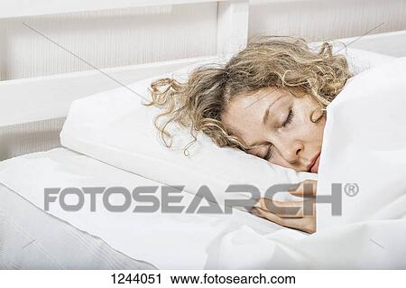 Woman sleeping n bed View Large Photo Image Stock Image - Woman sleeping n bed. Fotosearch