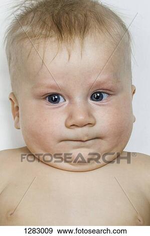 A baby boy grimacing, close-up View Large Photo Image Stock Photo - A baby boy grimacing, close-up. Fotosearch