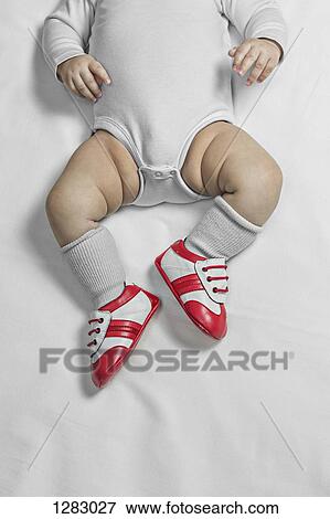 A baby boy wearing baby soccer shoes, waist down View Large Photo Image Stock Photo - A baby boy wearing baby soccer shoes, waist down. Fotosearch