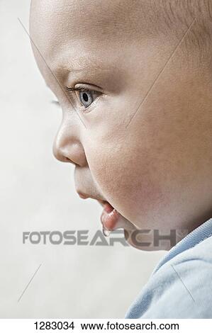 A baby staring off camera and drooling View Large Photo Image Picture - A baby staring off camera and drooling. Fotosearch