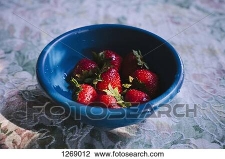 A bowel of fresh strawberries on a table with a patterned tablecloth View Large Photo Image Stock Image - A bowel of fresh strawberries on a table with a patterned tablecloth. Fotosearch