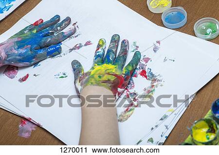 A child finger painting on paper View Large Photo Image Stock Image - A child finger painting on paper. Fotosearch