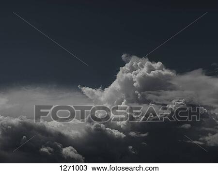 A cloudscape against a dark sky View Large Photo Image Stock Image - A cloudscape against a dark sky. Fotosearch