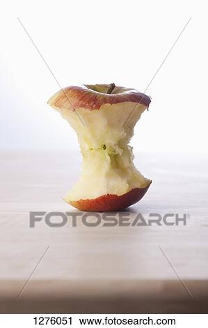 A fresh apple core on a table View Large Photo Image Stock Image - A fresh apple core on a table. Fotosearch
