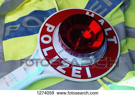 A German Police reflective jacket and a German hand stop sign with Halt Polizei (Stop Police) View Large Photo Image Stock Photo - A German Police reflective jacket and a German hand stop sign with Halt Polizei (Stop Police). Fotosearch