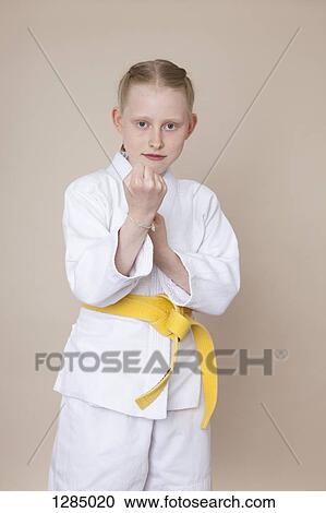 A girl in a martial arts fighting stance View Large Photo Image Stock Image - A girl in a martial arts fighting stance. Fotosearch