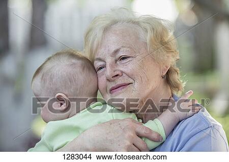 A grandmother embracing her grandson View Large Photo Image Picture - A grandmother embracing her grandson. Fotosearch