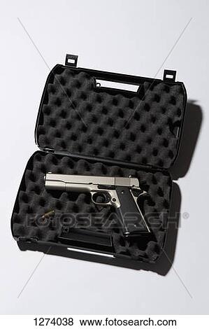 A handgun in a protected briefcase with a bullet View Large Photo Image Stock Photo - A handgun in a protected briefcase with a bullet. Fotosearch