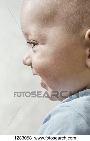 A happy baby boy, close-up View Large Photo Image Stock Photo - A happy baby boy, close-up. Fotosearch