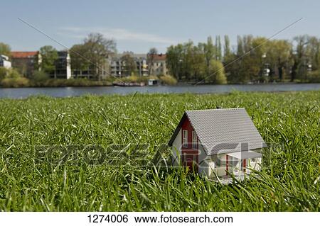 A miniature house on the lawn near the shore of a river View Large Photo Image Stock Photograph - A miniature house on the lawn near the shore of a river. Fotosearch