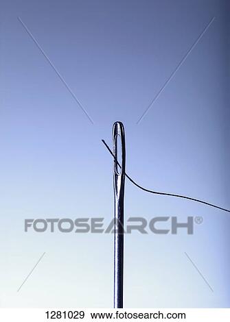 A needle being threaded, close-up View Large Photo Image Stock Photo - A needle being threaded, close-up. Fotosearch