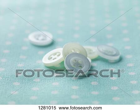 A pile of white buttons on patterned fabric View Large Photo Image Stock Photography - A pile of white buttons on patterned fabric. Fotosearch