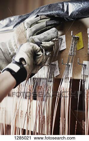 A repairman selecting a string for a piano, close-up of hands View Large Photo Image Stock Image - A repairman selecting a string for a piano, close-up of hands. Fotosearch