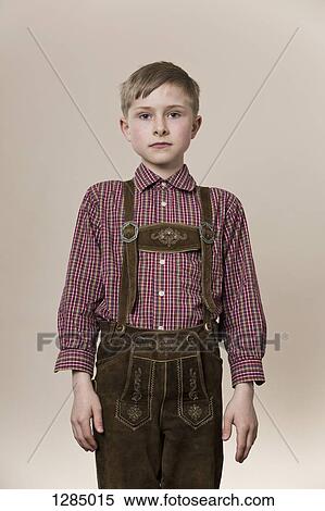 A serious boy wearing lederhosen View Large Photo Image Stock Photography - A serious boy wearing lederhosen. Fotosearch