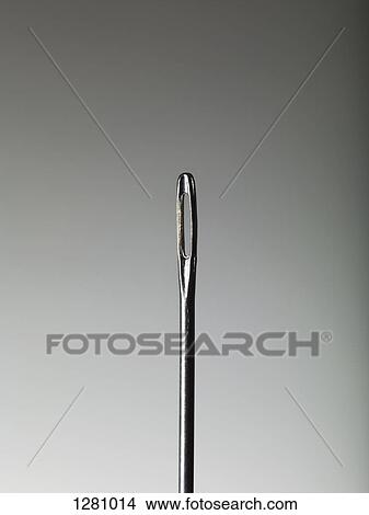 Picture - A sewing needle, close-up. Fotosearch
