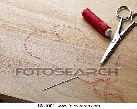 A spool of red thread, scissors, thread needle and thread shaped like a heart View Large Photo Image Stock Image - A spool of red thread, scissors, thread needle and thread shaped like a heart. Fotosearch