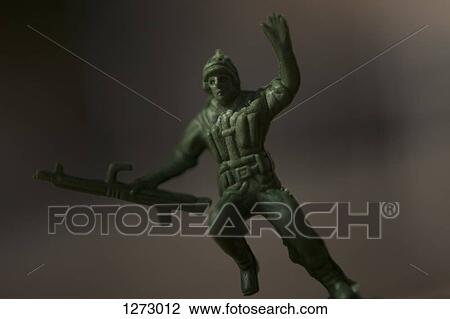 A toy soldier holding a rifle, falling after being shot View Large Photo Image Stock Image - A toy soldier holding a rifle, falling after being shot. Fotosearch
