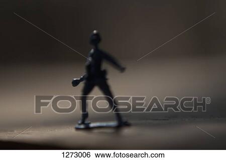A toy soldier preparing to throw something View Large Photo Image Stock Photograph - A toy soldier preparing to throw something. Fotosearch